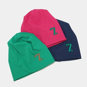 Three colorful ribbed knit beanies in pink, green, and blue with a 7th numeric patch