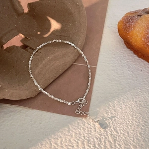 Macro detail of S925 sterling silver crushed style bracelet with lobster clasp