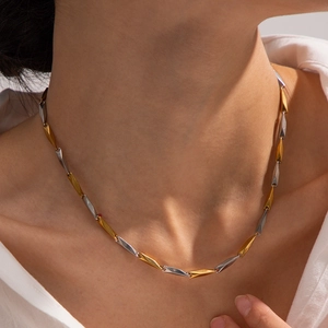 Two-tone gold and silver stainless steel heart necklace with geometric link chain