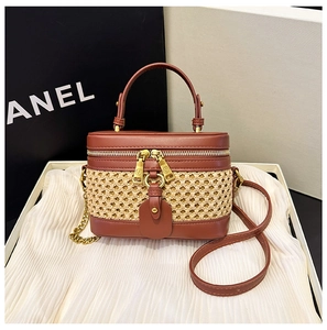 Elegant retro bamboo weaving and reddish-brown leather vanity bag with a long shoulder strap