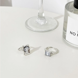 Detailed shot of 925 sterling silver rings with square zircon stones and S925 engraving