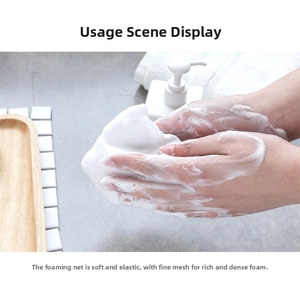 Close-up of a double-layer foaming net producing rich, thick white lather for skincare