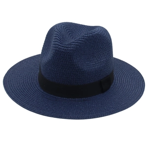 Detailed close-up of dark blue woven Panama hat with black decorative ribbon band