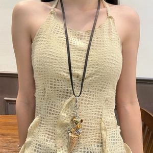 Bohemian multilayer ivory necklace with mixed metallic pendants on a dark leather cord