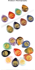 Detailed view of assorted teardrop gemstones with golden Tree of Life patterns