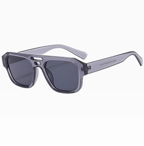 Macro view of model ZN3121 C2 engraved on the inner temple of clear grey sunglasses