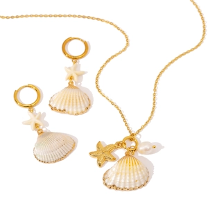 Elegant gold-tone stainless steel jewelry set featuring natural shells and starfish
