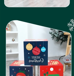 Detail of square Christmas gift boxes with festive patterns and Merry Christmas text