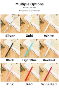 Multiple colors of heart crystal metal ballpoint pens displayed on a wooden surface