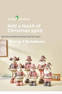 Detail of pink and grey plush Christmas dolls with knitted fabrics and faux fur trim