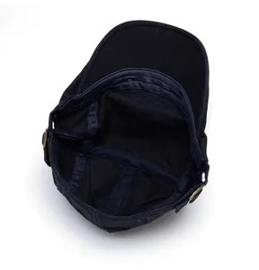 Detailed internal view showing cotton canvas stitching and metal side buckles of the army cap