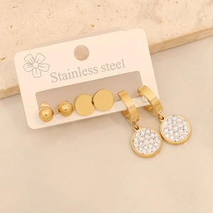 Macro view of gold stainless steel earring set featuring round studs and rhinestones