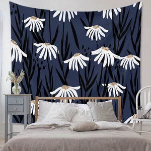 Detail of navy blue bohemian tapestry with daisy patterns in a bedroom setting