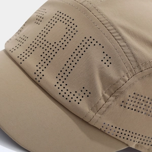 Detail of khaki quick-dry baseball cap featuring laser-cut ventilation and fine stitching