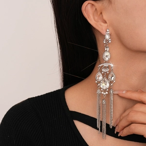 Exaggerated silver drop earrings with water-drop crystals and long metallic tassels