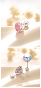 Macro shot of rose-cut gradient zircon earrings with screw-back design and silver base