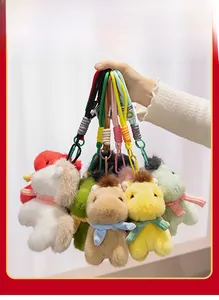 Detailed close-up of colorful plush pony keychains with knit scarves and plastic hooks
