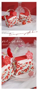 Detail of European floral wedding gift box with iridescent handle and flower tag