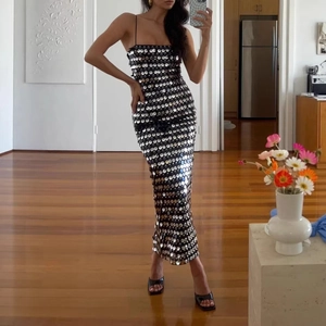 Detail of shimmering black and silver sequins on a sexy slim fit evening party dress
