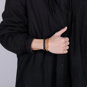 Men's hip hop gold and black double layer stainless steel Cuban link bracelet on model