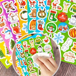 Close-up showing waterproof feature of cartoon Christmas stickers with water droplets
