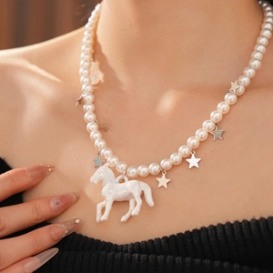 Elegant beaded pearl necklace featuring a white horse pendant and silver star charms