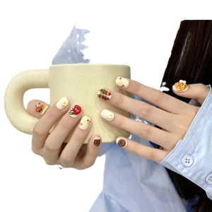 3D handmade food themed press-on nails featuring egg, strawberry and pizza designs