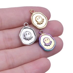 Three octopus pendants in gold, silver, and rainbow stainless steel with 18k plating