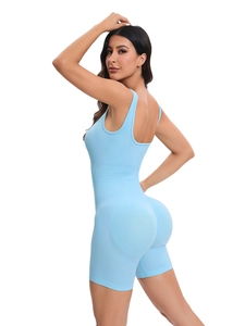 Close-up of light blue ribbed seamless yoga jumpsuit with u-neck and open back design