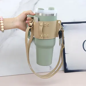 Detail view of khaki PU leather sleeve with card holder for 40oz tumbler with strap
