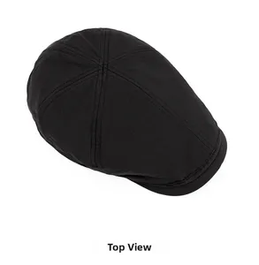 Top view of a black quick-dry ivy cap showing waterproof tech fabric and 6-panel stitching