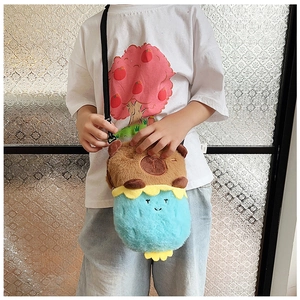 Kid wearing brown bear plush crossbody bag with soft blue body and adjustable strap