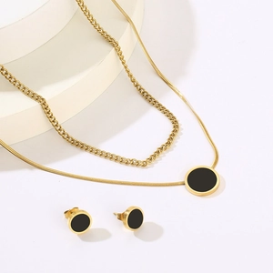 Double-layered gold snake chain necklace and earrings set with black shell pendants