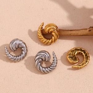Chic 18K gold and silver spiral horn stud earrings in minimalist stainless steel metal