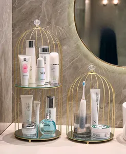 Detail view of luxurious golden birdcage-style iron racks with glass shelves for bathrooms