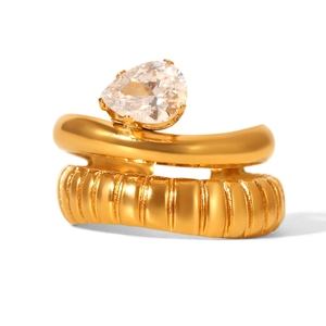 Detail of gold-plated double-layer ring featuring a pear-cut cubic zirconia stone inlay