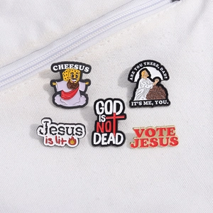 Close-up of funny religious enamel pins set featuring Cheesus and Jesus is Lit slogans