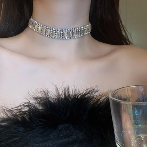 Close-up of luxury silver-tone choker with three rows of shimmering pavé set crystals