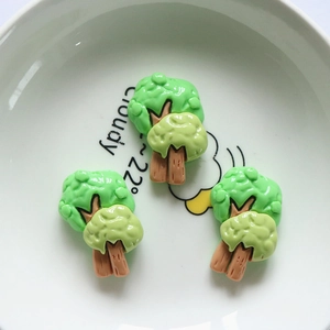 Detail of 3D green resin tree charms for DIY hairpins and stationery decoration