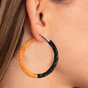 Oversized glitter hoop earrings with orange and black basketball-inspired split colors
