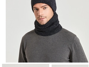 Close-up of men's knitted winter hat and neck warmer set in dark grey ribbed fabric