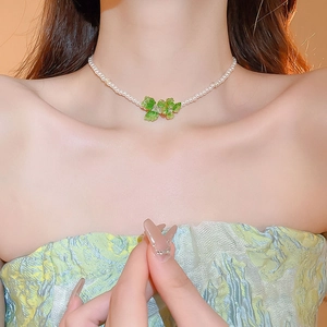 Elegant gold plated necklace with small pearls and green butterfly crystal charms