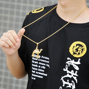 Detailed view of a golden 18K gold plated camel pendant necklace worn by a fashion model