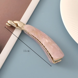 Detail of 11cm pink marble acetate banana hair clip with gold metal base for ponytails