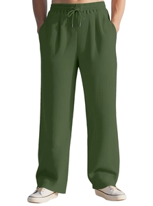 Detailed view of olive green pleated wide-leg trousers with drawstring elastic waistband