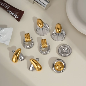 Set of two-tone gold and silver stainless steel earrings in shell and geometric shapes