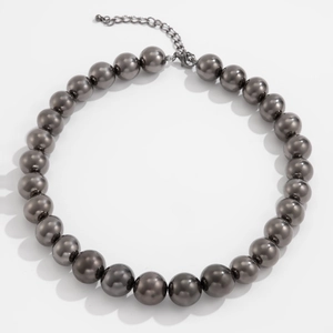 Macro view of gunmetal CCB beaded necklace showing beads texture and lobster clasp