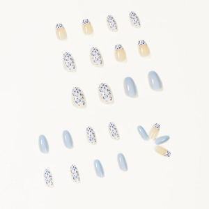 Short ballet press-on nails in cream white and baby blue floral and leopard patterns