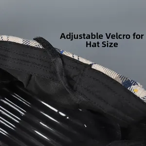 Close-up of the adjustable Velcro strap inside the plaid beret for custom fit sizing