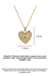 Detail showing gold heart pendant with evil eye design and micro-pave crystals